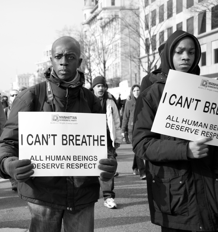 Two Black men at a protest.