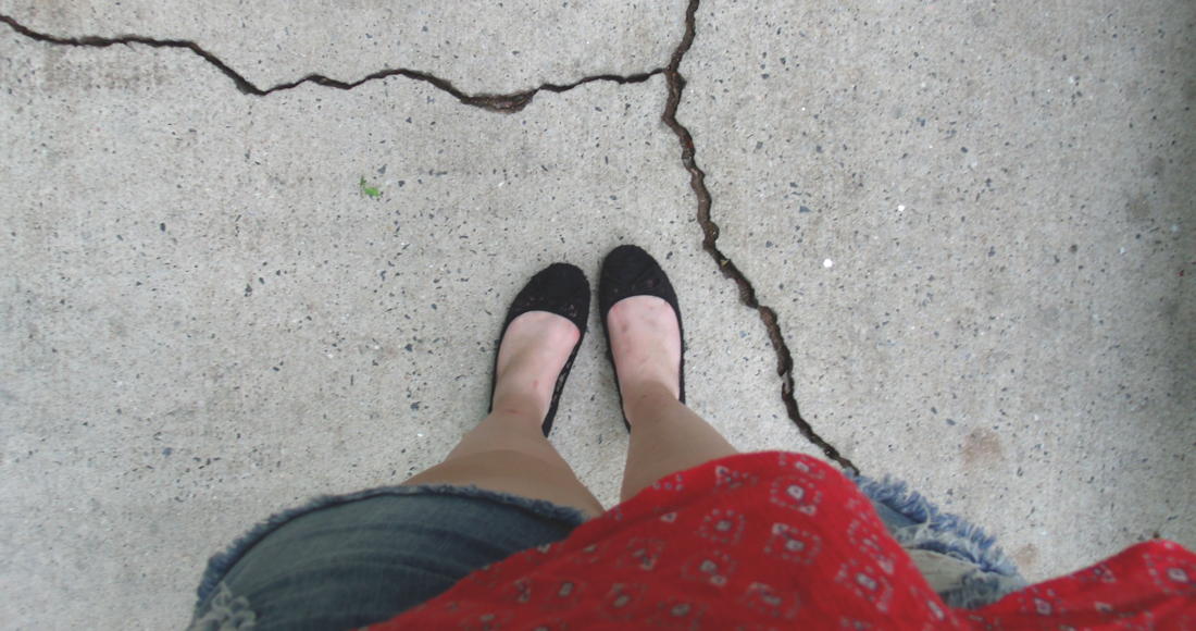 People with OCD might fear stepping on a sidewalk crack.